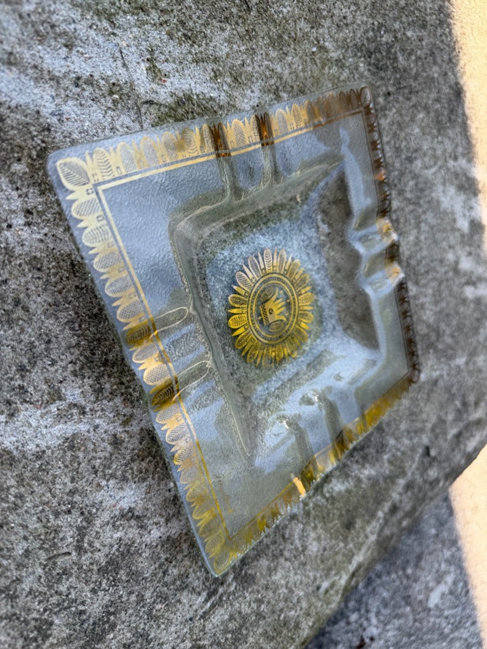 vintage Georges Briard glass tray featuring a gold sunflower or crown an ashtray
